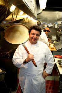 Chef William with a pan to make Borlengo, a bread traditionally made in Modena