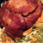Dinner Idea:Crisp and juicy pork schnitzel on buttered tricolor noodles with sautéed apples and steamed veggies! #yum #wowmoment #whatsfordinner #porklove #noodles #porky